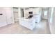 Bright kitchen featuring an island with bar seating and stainless steel appliances at 3219 Cup Dr, Lakeland, FL 33803