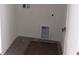 Bright laundry room featuring tile flooring and hookups for washer and dryer at 3219 Cup Dr, Lakeland, FL 33803