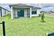 Landscaped backyard with a covered patio, perfect for outdoor enjoyment at 3352 Cup Dr, Lakeland, FL 33803