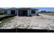 View of the home's backyard showing the covered patio and the start of landscaping at 3352 Cup Dr, Lakeland, FL 33803