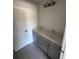 Modern bathroom with double sink vanity, gray cabinets, and chrome fixtures at 3352 Cup Dr, Lakeland, FL 33803
