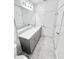 Bathroom showcasing gray cabinets, a white countertop, tile floors, and modern fixtures at 3352 Cup Dr, Lakeland, FL 33803