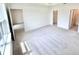 Bright and airy bedroom featuring plush gray carpeting and an ensuite bathroom with ample natural light at 3352 Cup Dr, Lakeland, FL 33803