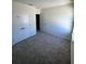 Spacious bedroom with plush carpeting and ample closet space, providing comfort and functionality at 3352 Cup Dr, Lakeland, FL 33803