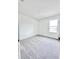 Bright, carpeted bedroom with natural light, showcasing a neutral color scheme and a simple, clean design at 3352 Cup Dr, Lakeland, FL 33803