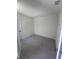 Light-filled bedroom with gray tile floors and a modern minimalist design at 3352 Cup Dr, Lakeland, FL 33803
