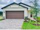 Charming one-story home featuring a two-car garage and beautifully landscaped front yard at 3352 Cup Dr, Lakeland, FL 33803