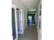 Bright hallway leading to the living area, offering seamless transition and access to various rooms at 3352 Cup Dr, Lakeland, FL 33803