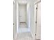 Bright hallway with tile flooring and white trim at 3352 Cup Dr, Lakeland, FL 33803