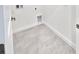 Functional laundry room with tile flooring, utility connections, and white trim at 3352 Cup Dr, Lakeland, FL 33803