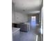 Open-concept living room with natural light, tile flooring, and a seamless transition to the outdoor space at 3352 Cup Dr, Lakeland, FL 33803