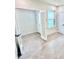 Bright room with neutral walls, tile flooring, and double doors at 3352 Cup Dr, Lakeland, FL 33803