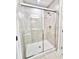 Glass enclosed shower with gray tile and chrome fixtures at 3352 Cup Dr, Lakeland, FL 33803