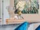 Stylish bar countertop featuring cocktail glasses, shaker, and a decorative floral arrangement at 3629 Marlberry Way, Sanford, FL 32773