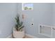 Bright laundry room with light blue walls and built-in connections for washer and dryer at 3635 Marlberry Way, Sanford, FL 32773