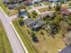 Aerial view of the house highlighting the location, roof, and landscaped yard at 401 Cart Ct, Kissimmee, FL 34759