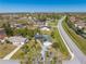 Spacious home with solar panels, lush greenery, and a large driveway in a peaceful neighborhood at 401 Cart Ct, Kissimmee, FL 34759