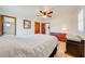 Large bedroom with ensuite bathroom and tile floors at 401 Cart Ct, Kissimmee, FL 34759