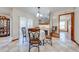 Charming dining area with decorative chairs, a floral tablecloth, and a view into other rooms at 401 Cart Ct, Kissimmee, FL 34759