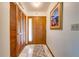 Entryway with wood door and closet providing ample storage space at 401 Cart Ct, Kissimmee, FL 34759
