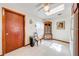 Bright kitchen area with tile floors, ceiling fan, and display cabinet at 401 Cart Ct, Kissimmee, FL 34759