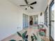 Bright sunroom with large windows and sliding doors, perfect for relaxing and enjoying the view at 401 Cart Ct, Kissimmee, FL 34759