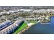 Aerial view of complex on lakefront featuring beach access, pool, and docks at 4117 Fairview Vista Pt # 206, Orlando, FL 32804