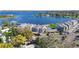 Aerial view featuring community pool, assigned carport parking, and a picturesque lakeside setting at 4117 Fairview Vista Pt # 206, Orlando, FL 32804