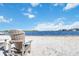 Community beach on the lake, featuring lounge chairs and sandy shore at 4117 Fairview Vista Pt # 206, Orlando, FL 32804