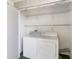 Laundry room with washer and dryer, shelving, and ample space at 4117 Fairview Vista Pt # 206, Orlando, FL 32804