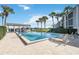 Community pool with deck and lounge chairs at 4117 Fairview Vista Pt # 206, Orlando, FL 32804
