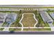 Aerial view of a green space between houses with landscaped paths and benches for residents at 4484 Lions Gate Ave, Clermont, FL 34711