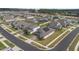 Overhead view of the neighborhood with the home featuring solar panels on the roof at 4484 Lions Gate Ave, Clermont, FL 34711