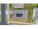 Aerial view of a home featuring solar panels on the roof and a brick driveway at 4484 Lions Gate Ave, Clermont, FL 34711