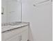 Bathroom vanity featuring granite countertop and a large mirror at 4484 Lions Gate Ave, Clermont, FL 34711