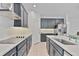Modern kitchen featuring stainless steel appliances, white countertops, and ample cabinet space at 4484 Lions Gate Ave, Clermont, FL 34711