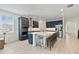 Spacious modern kitchen with a large center island, stainless steel appliances, and bar stool seating at 4484 Lions Gate Ave, Clermont, FL 34711