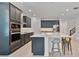 Modern kitchen with a large center island, stainless steel appliances, and stylish cabinetry at 4484 Lions Gate Ave, Clermont, FL 34711
