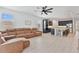 Open floorplan view from living room to kitchen with an eat-in island and stainless steel appliances at 4484 Lions Gate Ave, Clermont, FL 34711