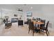 Open-concept living room and dining area with modern decor and plenty of space at 4484 Lions Gate Ave, Clermont, FL 34711