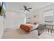 Inviting main bedroom with plush carpeting, neutral walls, and ample natural light from the dual windows at 4484 Lions Gate Ave, Clermont, FL 34711