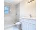 Modern bathroom featuring a marble stand-up shower and stylish vanity with a quartz countertop at 4502 Florence St, Apopka, FL 32712