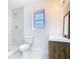 Modern bathroom featuring a stand-up shower, decorative vanity, and window at 4502 Florence St, Apopka, FL 32712