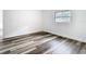 Bedroom with wood grain floors and one window at 4502 Florence St, Apopka, FL 32712