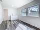 Room with wood grain floors, window, and sink at 4502 Florence St, Apopka, FL 32712