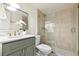 Bathroom featuring a glass shower, hexagon tile floor, and marble countertop vanity at 535 N Interlachen Ave # 106, Winter Park, FL 32789