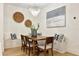 Elegant dining area with stylish lighting, a wooden table, and built-in seating at 535 N Interlachen Ave # 106, Winter Park, FL 32789