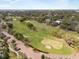 Expansive green golf course with mature trees and a picturesque surrounding neighborhood at 535 N Interlachen Ave # 106, Winter Park, FL 32789