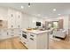 Open kitchen with marble countertops, stainless steel appliances, and direct view into the living room at 535 N Interlachen Ave # 106, Winter Park, FL 32789