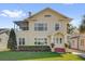 Charming two-story home with a well-manicured lawn and beautiful landscaping at 620 Park Lake St, Orlando, FL 32803